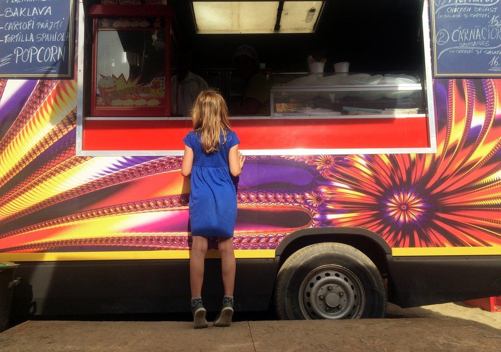 Girl buying from a food truck