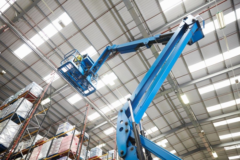 Moving stock in a warehouse with a cherry picker