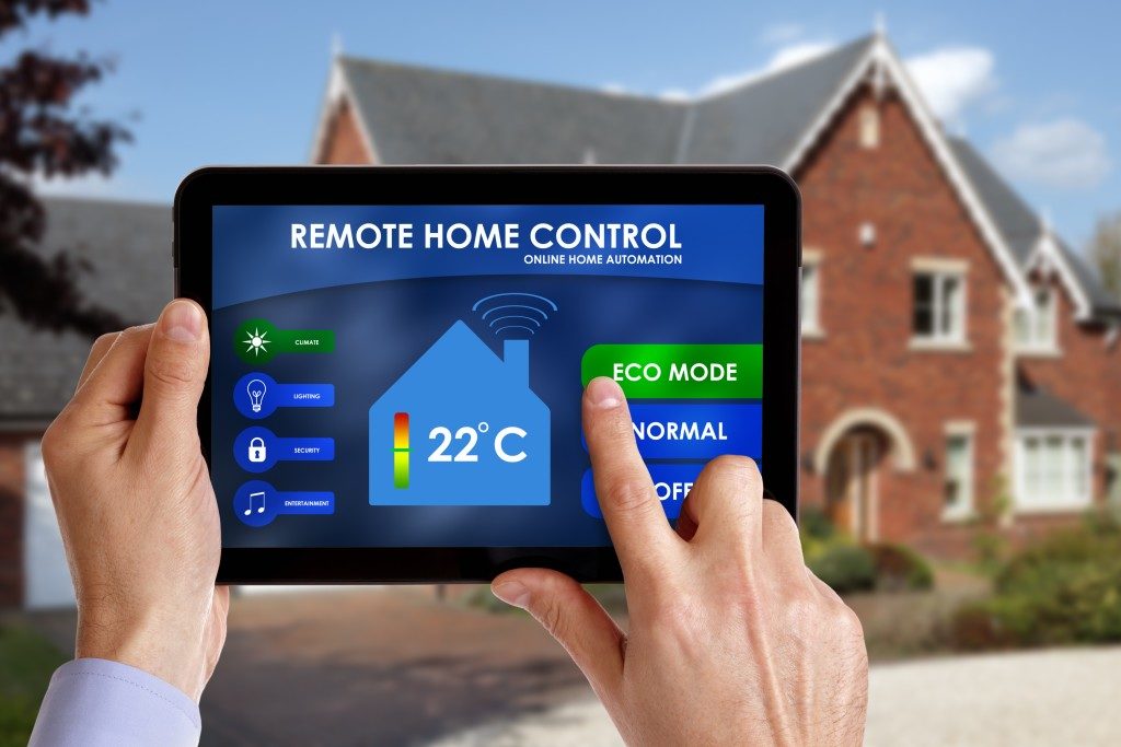 Person holding a remote home control