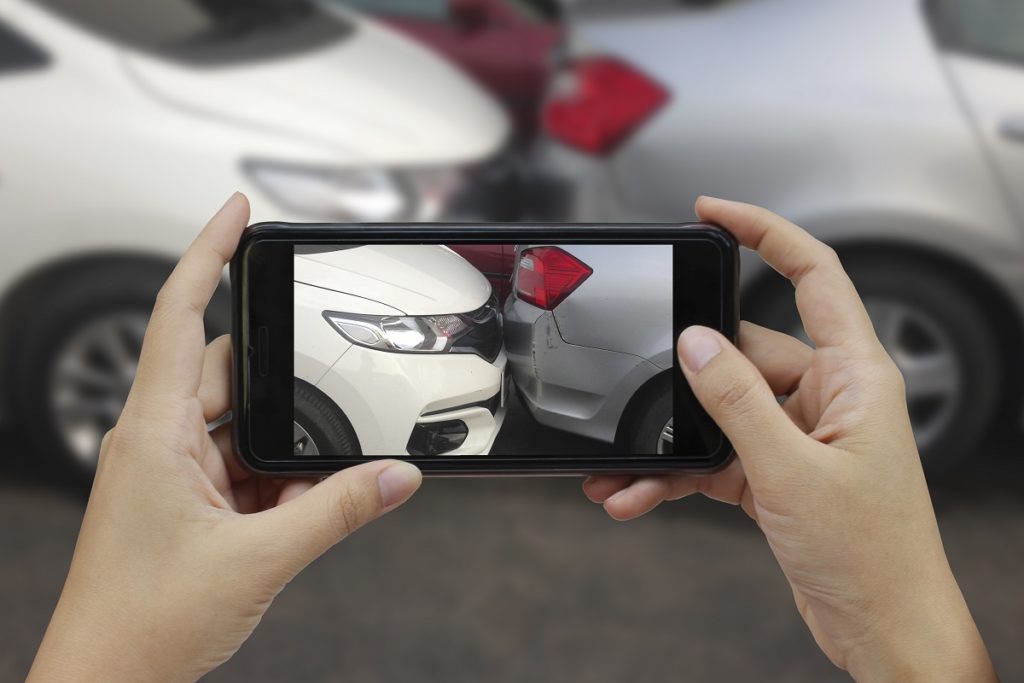 Taking a picture of a car accident