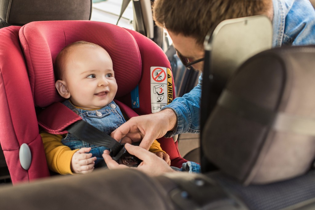 baby wearing car seatbelt