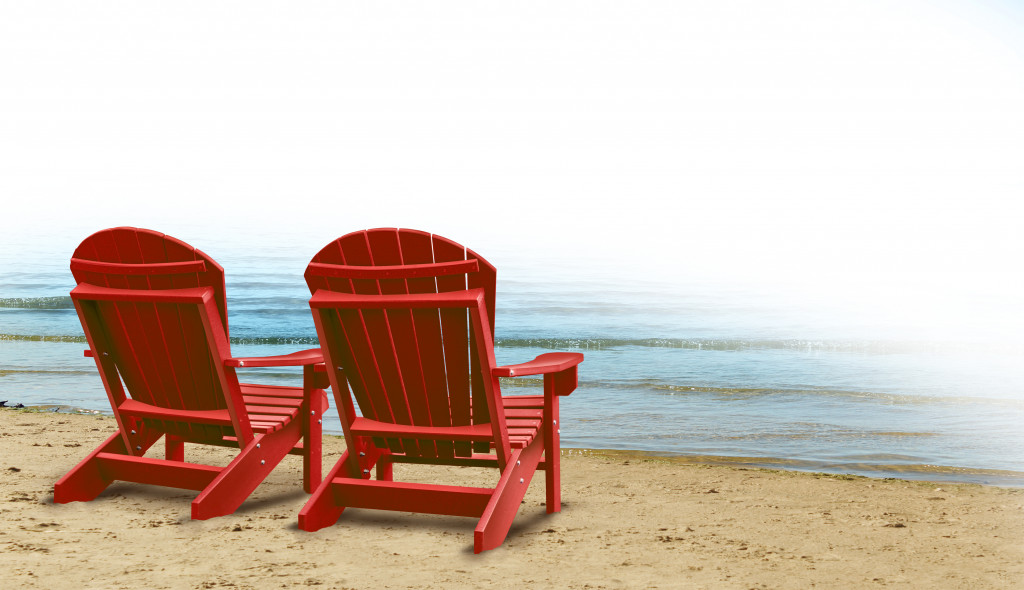 red beach chairs by the sea